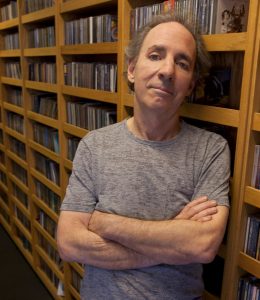 Harry Shearer standing in the KCRW halls